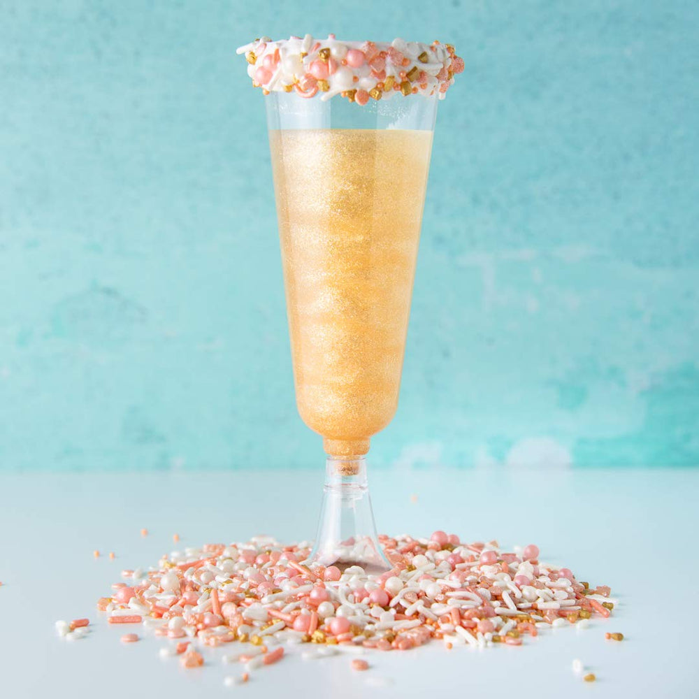 Sweets Indeed Peach Rose Gold sprinkles atop cupcakes for celebration-ready treats.