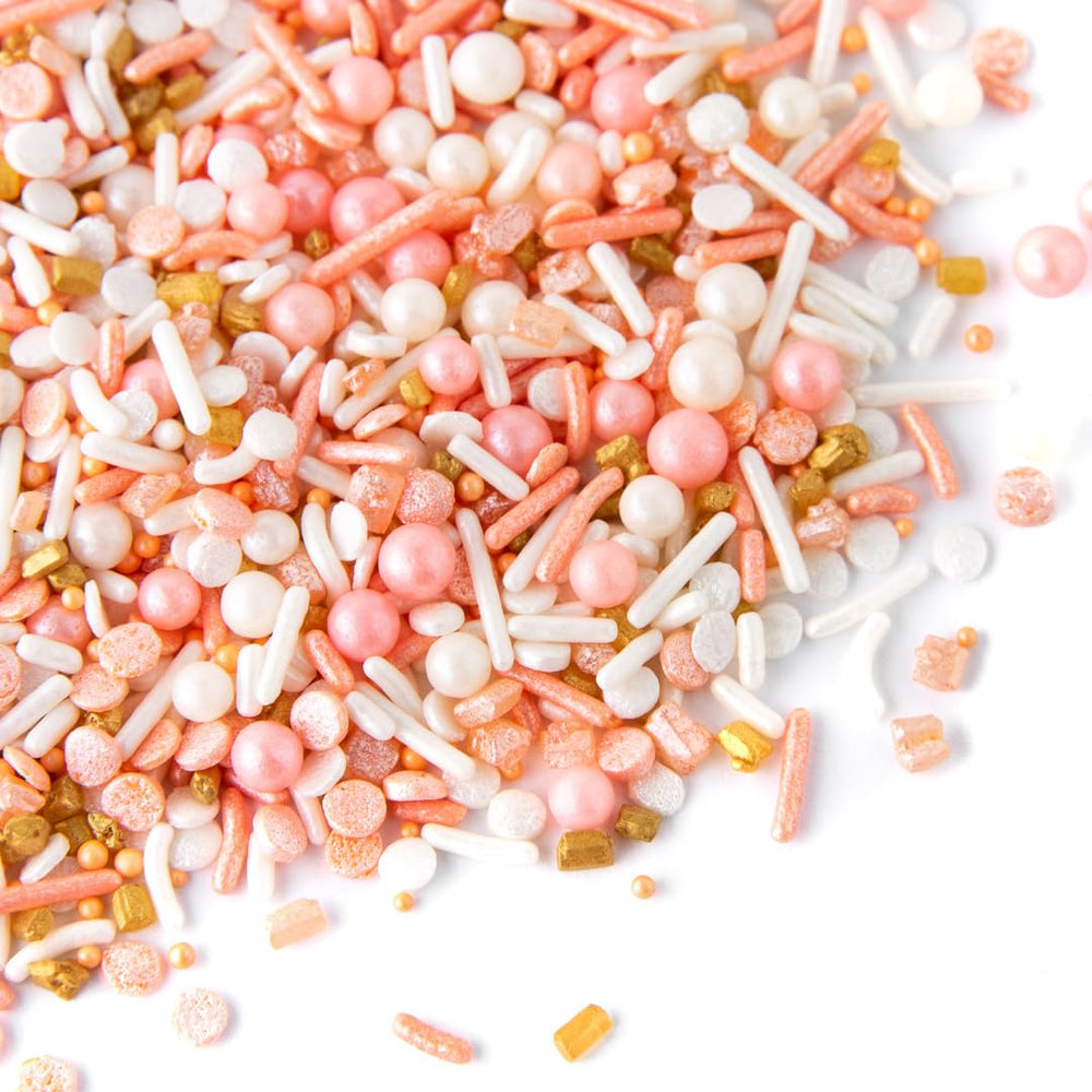 Sweets Indeed Peach Rose Gold sprinkles on ice cream for playful texture.