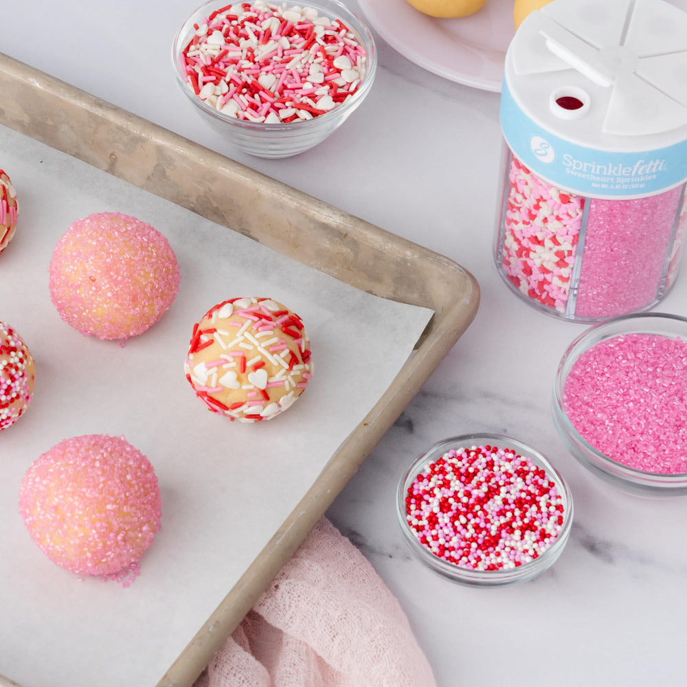 Sweets Indeed Valentine sprinkles on cupcakes for quick, colorful decor.