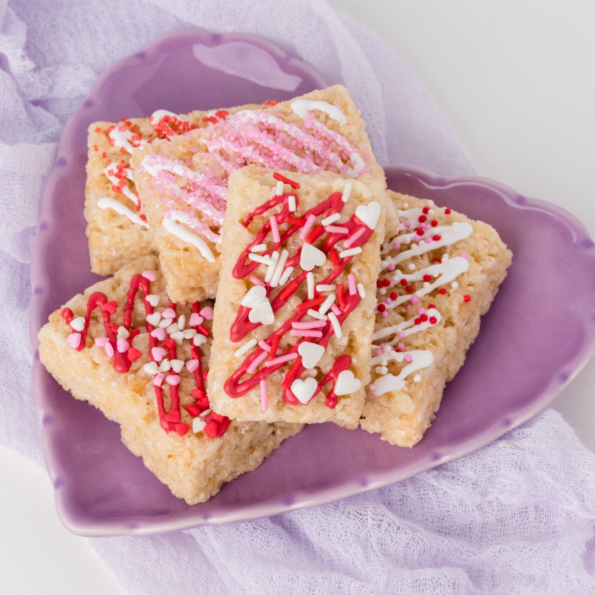 Sweets Indeed sprinkles top donuts with a Valentine flair and color.