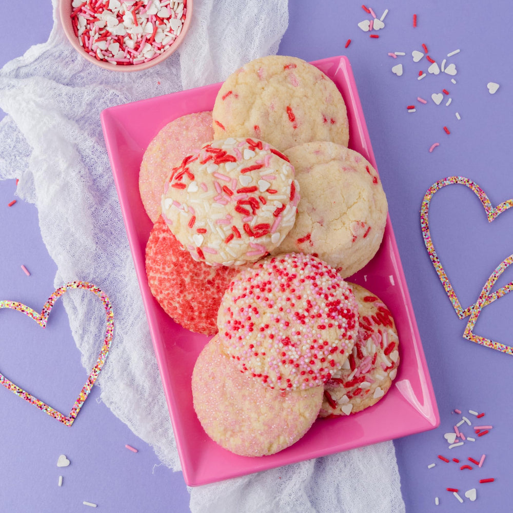 Sweets Indeed Valentine jimmies mix features white hearts for elegant finishes.