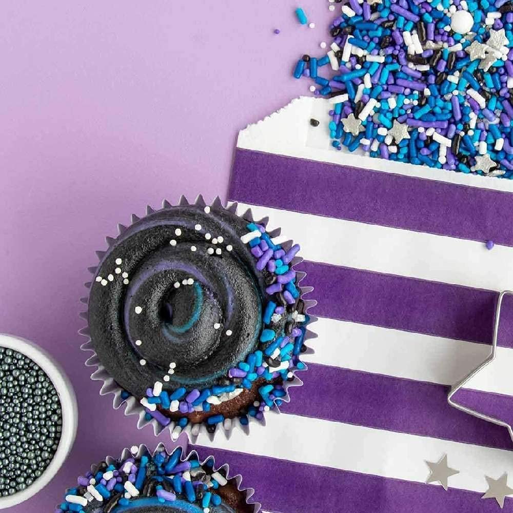 Sweets & Treats Boutique Blue and Purple Jimmies brighten space-themed treats.