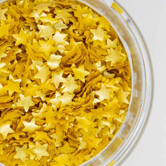 Sweets & Treats Boutique Gold Star Glitter decorates cakes with edible sparkling shine