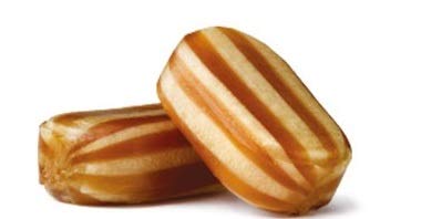 Sweetshop Bonds Of London mint humbugs close-up, crisp shell with chewy toffee center.