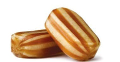 Sweetshop Bonds Of London mint humbugs close-up, crisp shell with chewy toffee center.