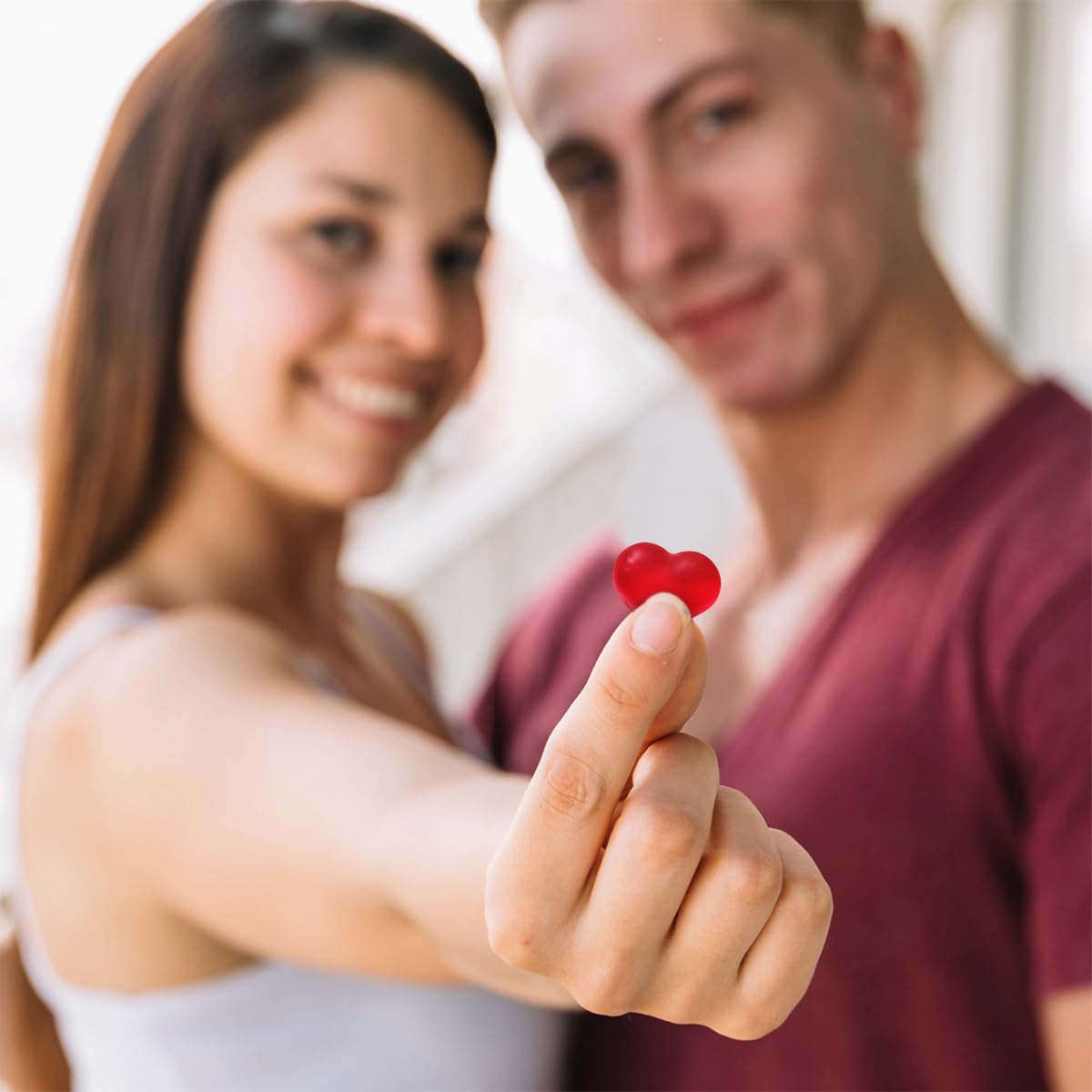 Close-up of soft-chew SWEETSIDE gummy hearts texture.