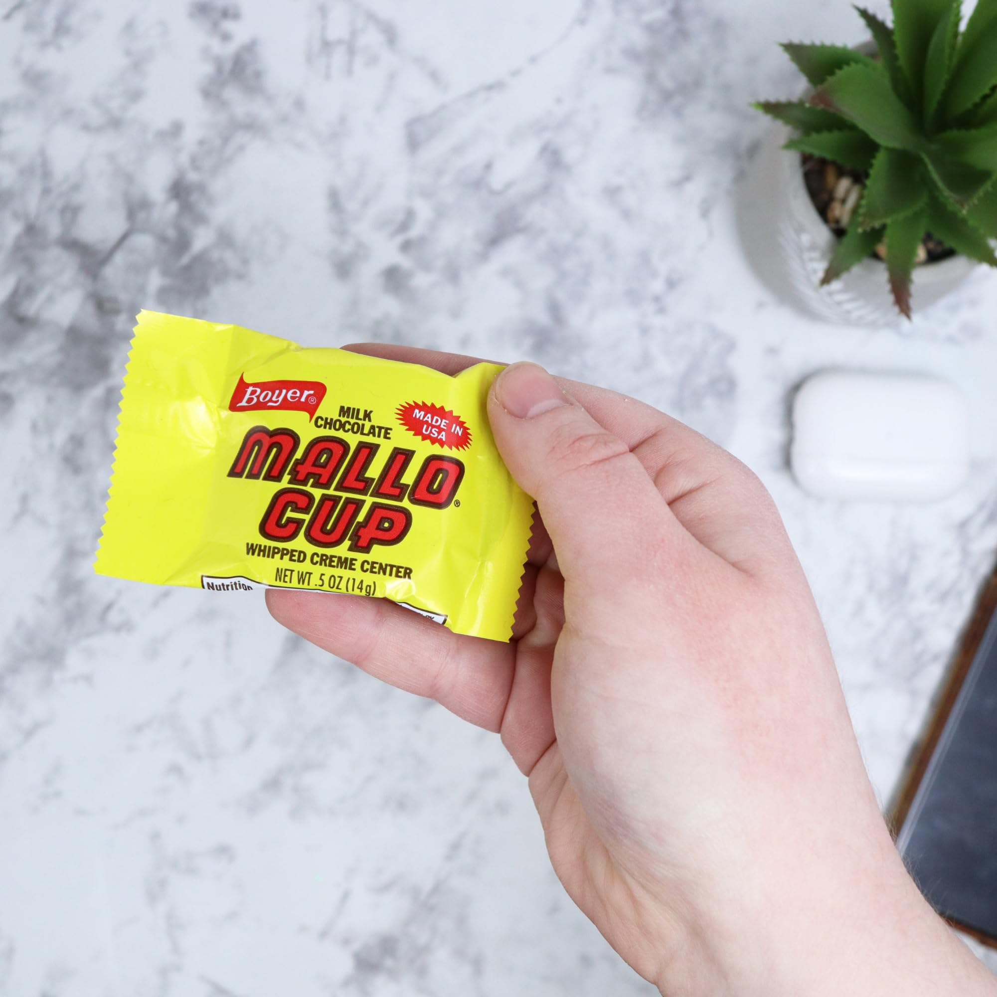 Sweetzo Boyer Mallo Cups unwrapped, showcasing creamy marshmallow filling.