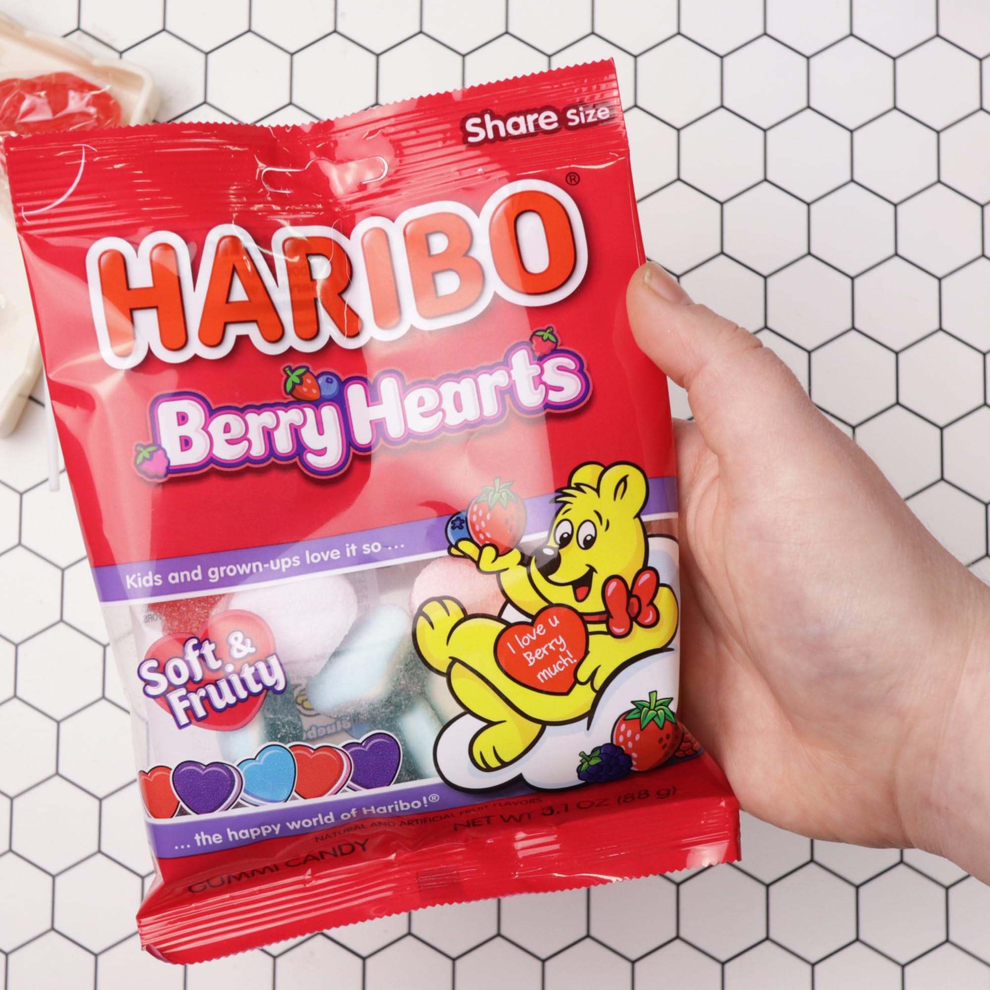 Colorful heart-shaped gummies adding festive color to treat bags.
