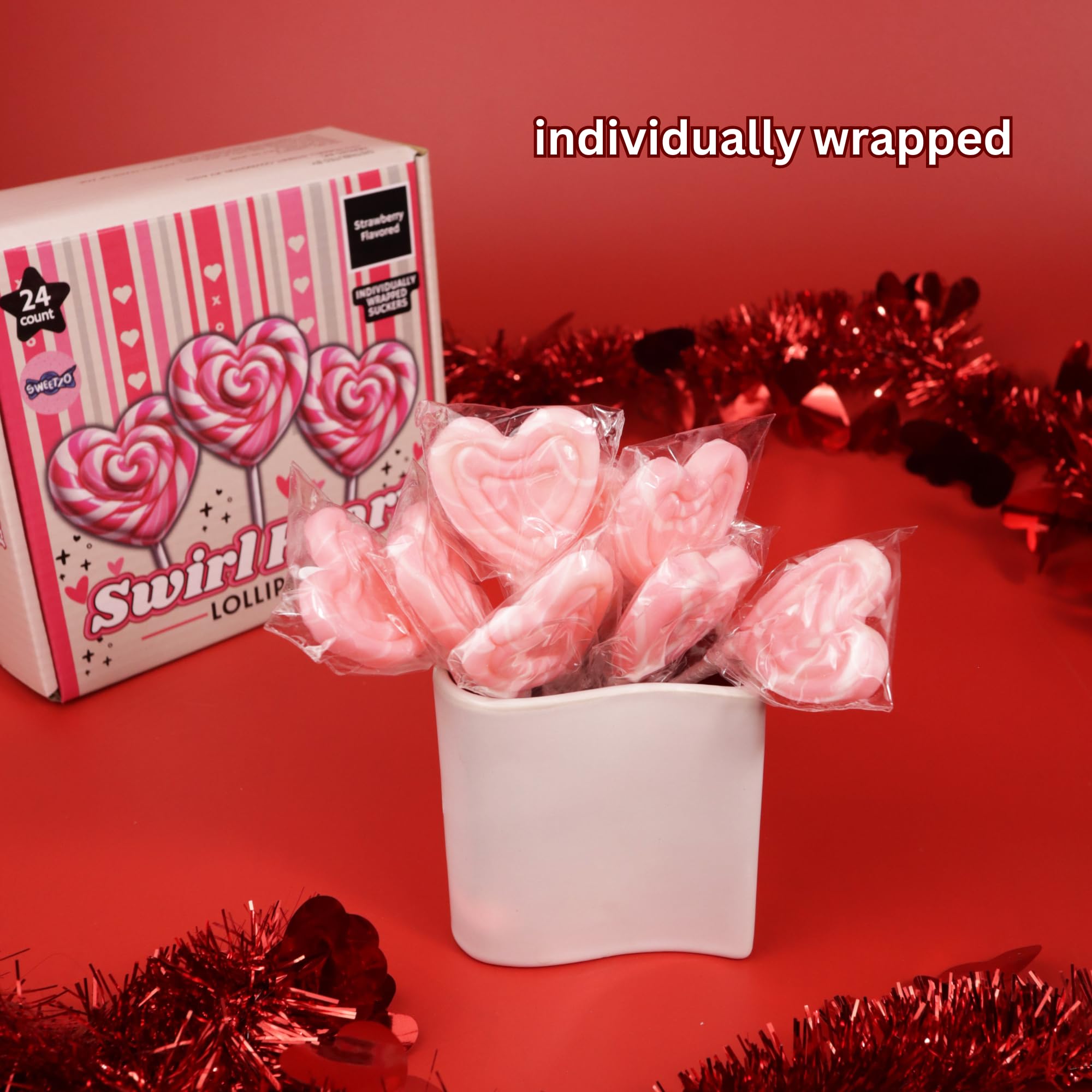 Sweetzo Heart Swirl Lollipops displayed at a party display.