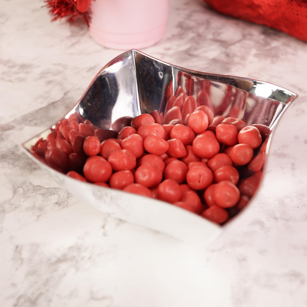 Closeup of strawberry-coated sugar cookie dough texture.