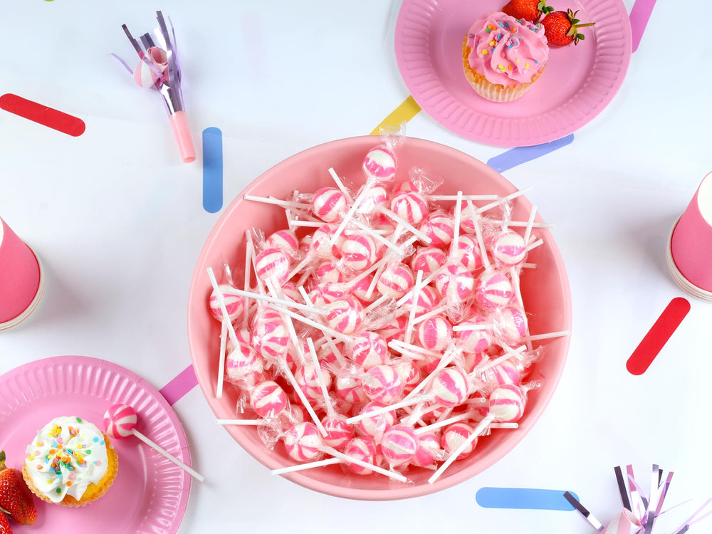 SWIRLEEY bunny-themed dessert tables with pink and white lollipops.