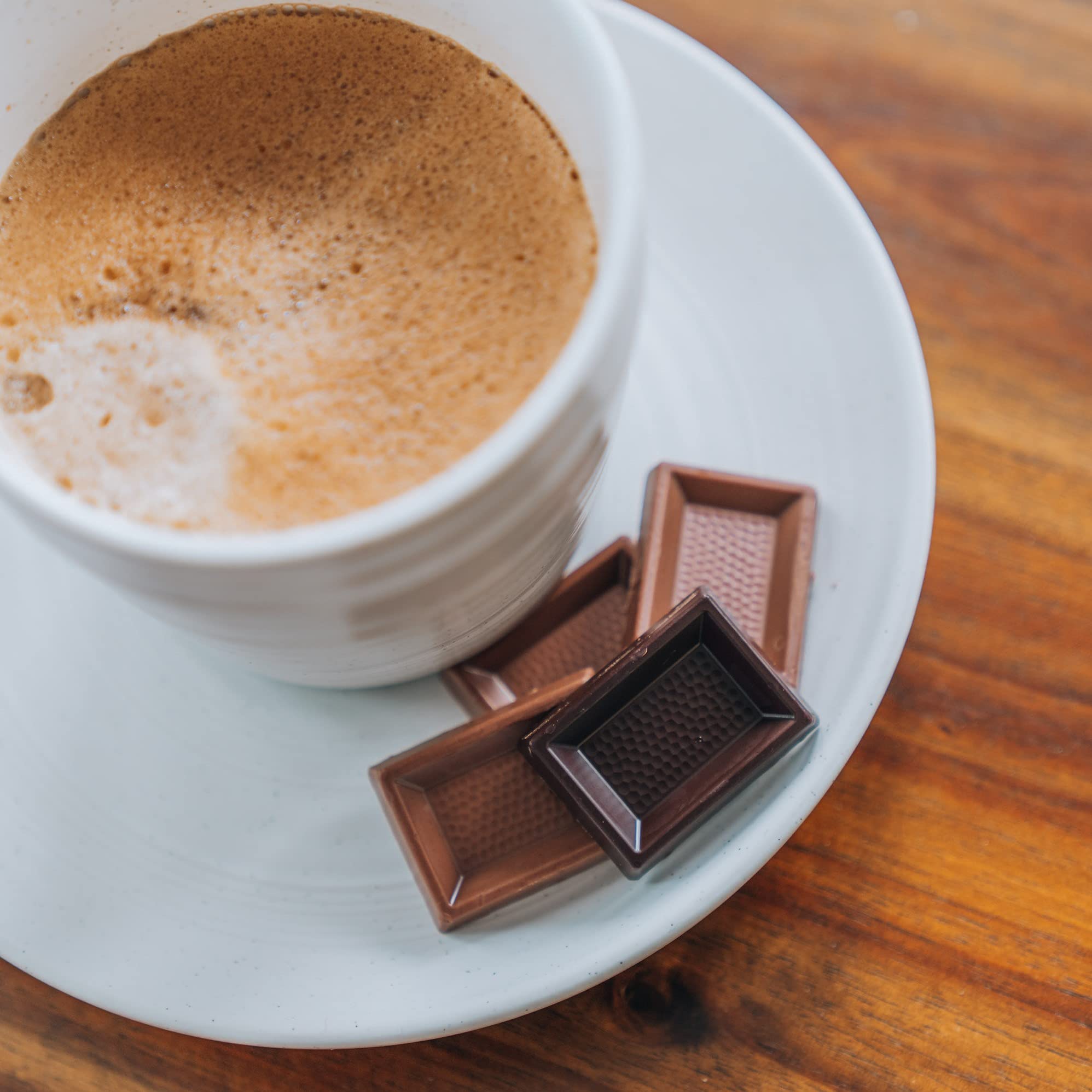 Swiss Delice lifestyle shot featuring creamy milk chocolate as a luxurious snack.