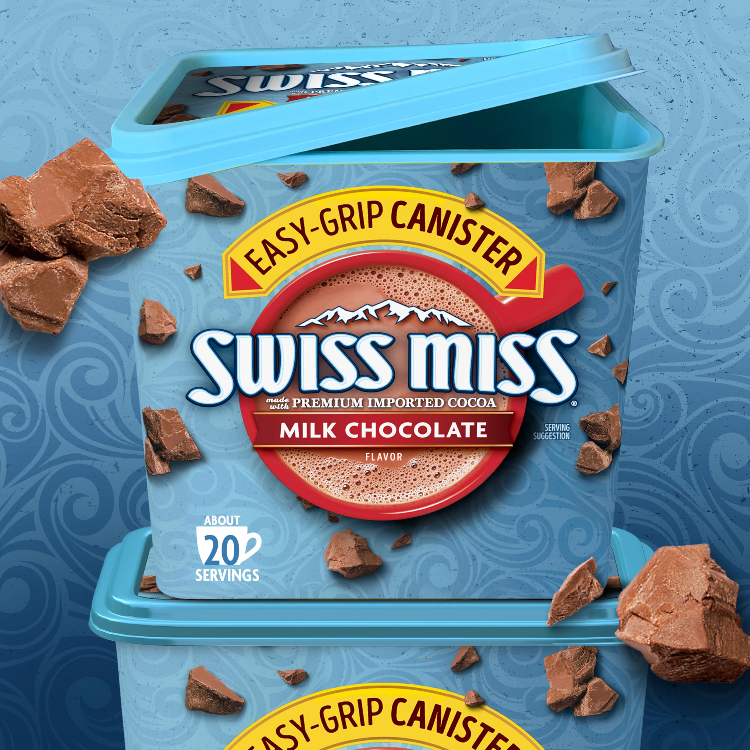 Swiss Miss cocoa with marshmallows beside mug, cozy treat.