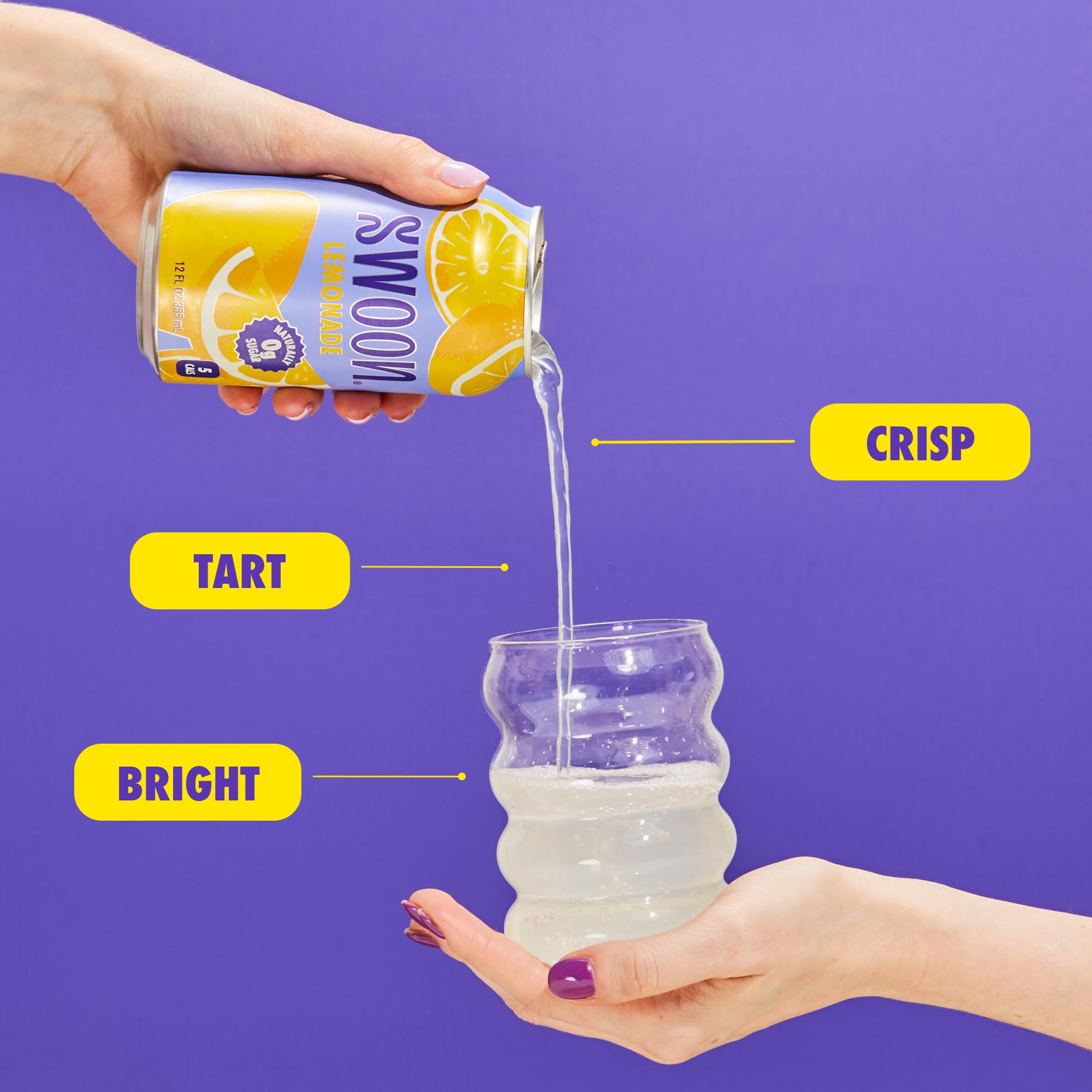 Glass of Swoon Lemonade with fresh lemons and mint.