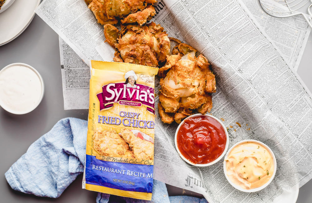 Serving plate of golden fried chicken with Sylvia's Southern flavor.