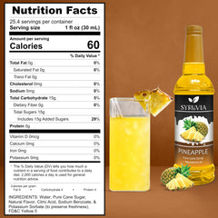 SYRUVIA Pineapple Syrup being poured into a glass for refreshing beverages.
