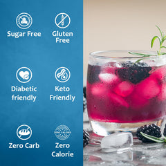 Dessert-topping view of SYRUVIA Sugar-Free Blackberry Syrup over a fruit dessert.