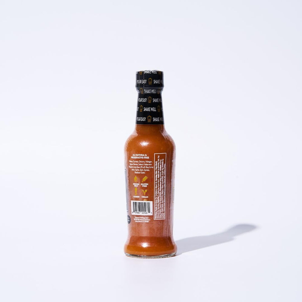 Tabanero Original Hot Sauce on tacos at dinner.