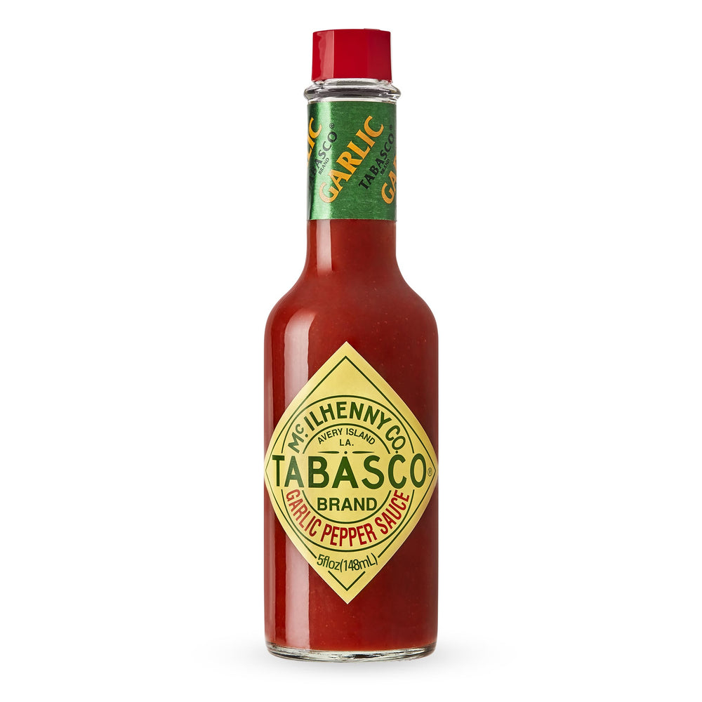 TABASCO Cayenne Garlic Pepper Sauce bottle adds smoky, savory flavor to meals.
