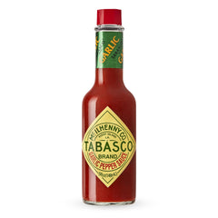 TABASCO Cayenne Garlic Pepper Sauce bottle adds smoky, savory flavor to meals.