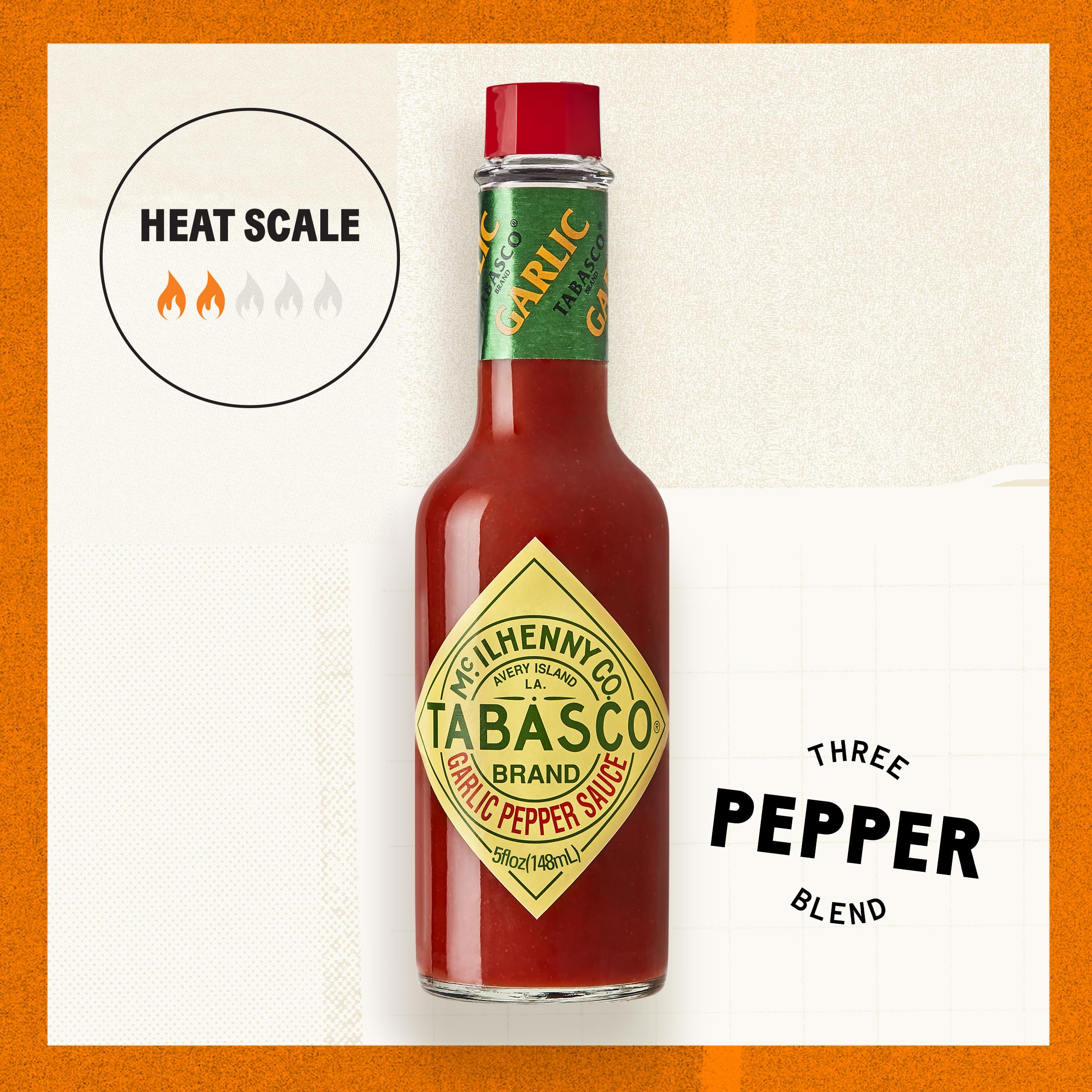 TABASCO Cayenne Garlic Pepper Sauce glass bottle shown in a modern kitchen.