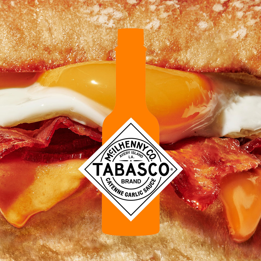 TABASCO Cayenne Garlic Pepper Sauce on pizza enhances Italian taste with garlic warmth.
