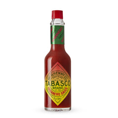 TABASCO Habanero sauce glass bottle front, adding Caribbean heat to meals.