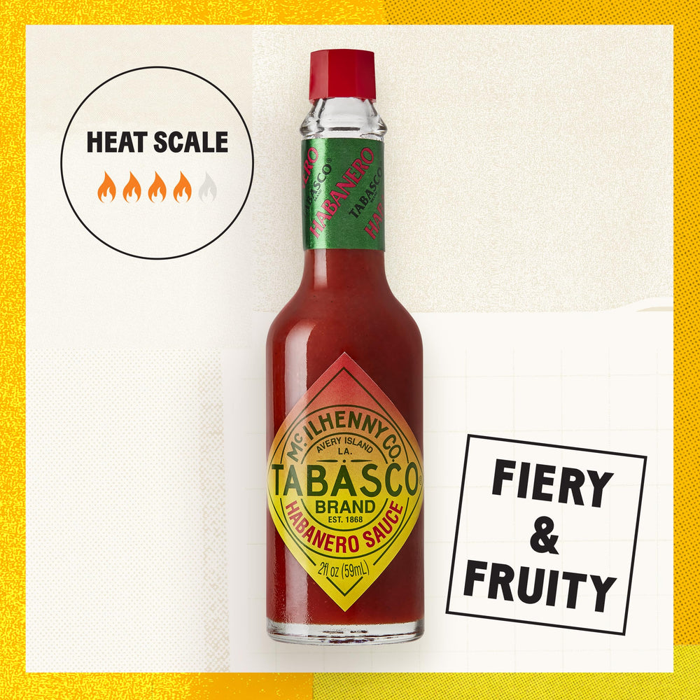 TABASCO Habanero sauce pouring action over food.