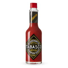 TABASCO Scorpion Sauce bottle on counter shows bold heat for tacos.