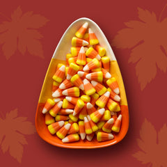 Taboom fall buffet centerpiece featuring bright candy corn accents.