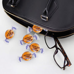 Taboom candy dish on a desk showcasing sugar-free treats for work.