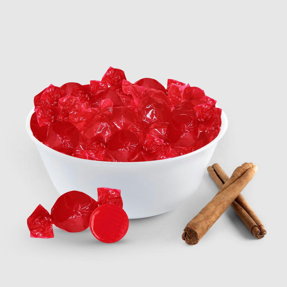 Taboom red cinnamon-discs at a holiday display for seasonal treats.