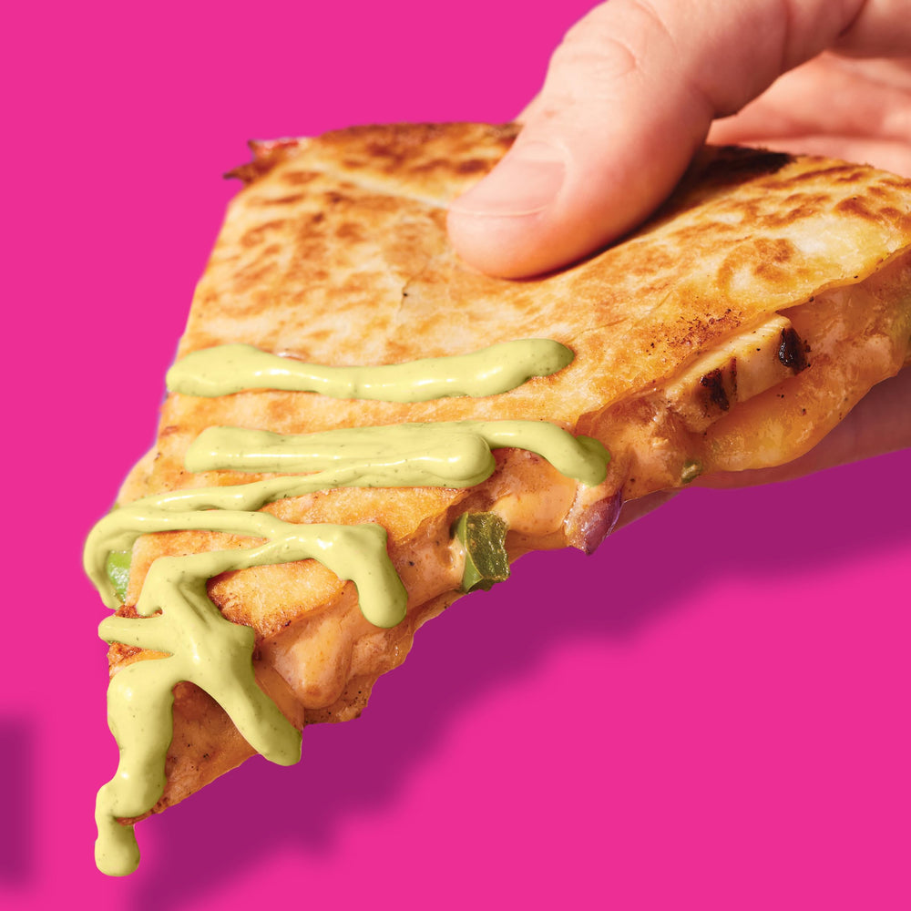 Taco Bell Creamy Avocado Ranch Sauce adds zesty creaminess to enchiladas.