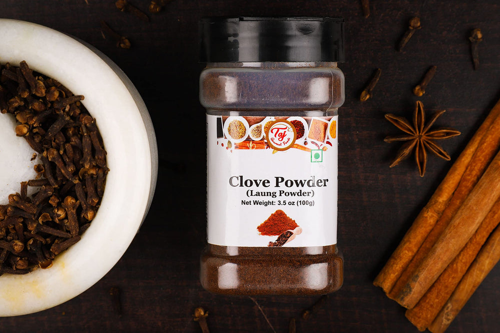 TAJ Gourmet Clove Powder in mulled-wine glass for seasonal aroma.
