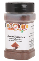 TAJ Gourmet Clove Powder pouring from bottle for easy seasoning.