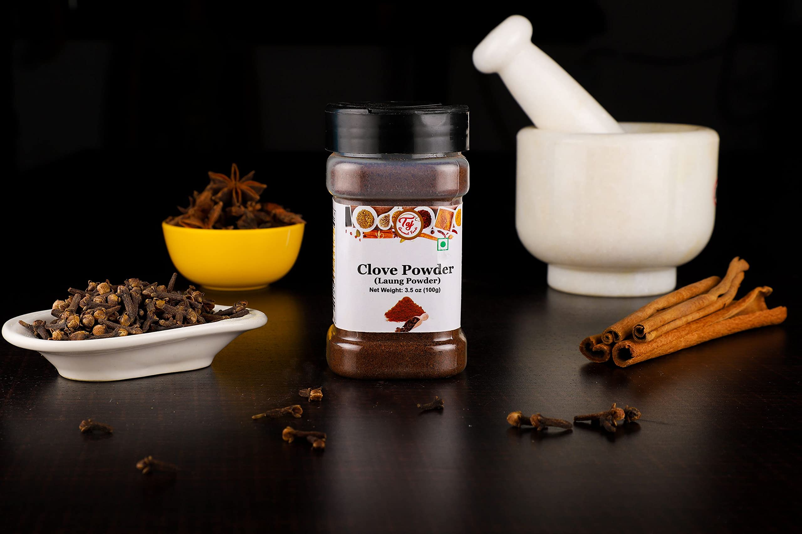 TAJ Gourmet Clove Powder in spice-mix bowl for marinades.