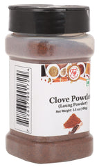 Close-up texture of TAJ Gourmet Clove Powder showing fine grind.