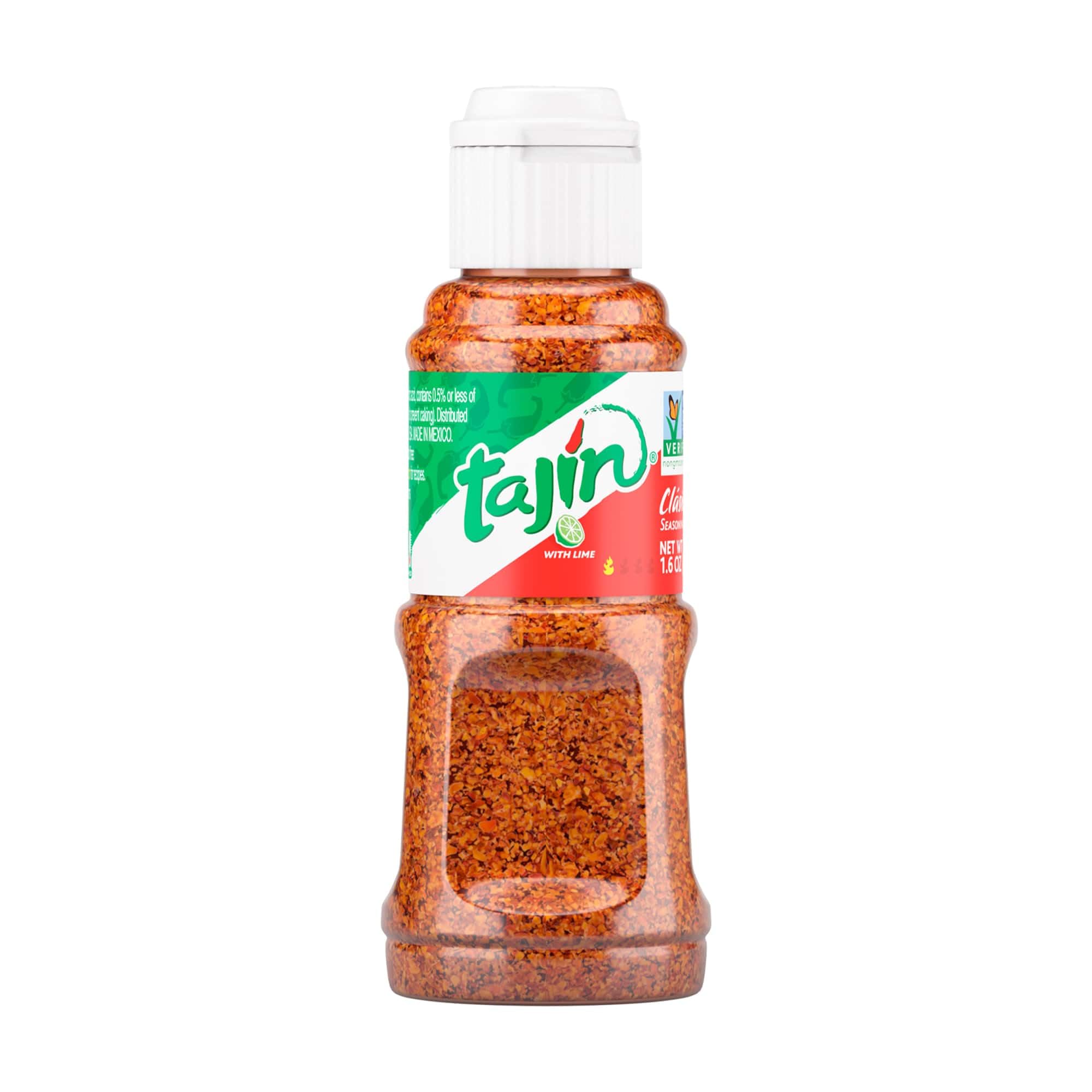 Tajin Classic mini bottle pours on fruit for a bright lime kick