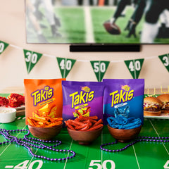 Tabletop display of Takis variety pack emphasizes quick grab-and-go snacking.