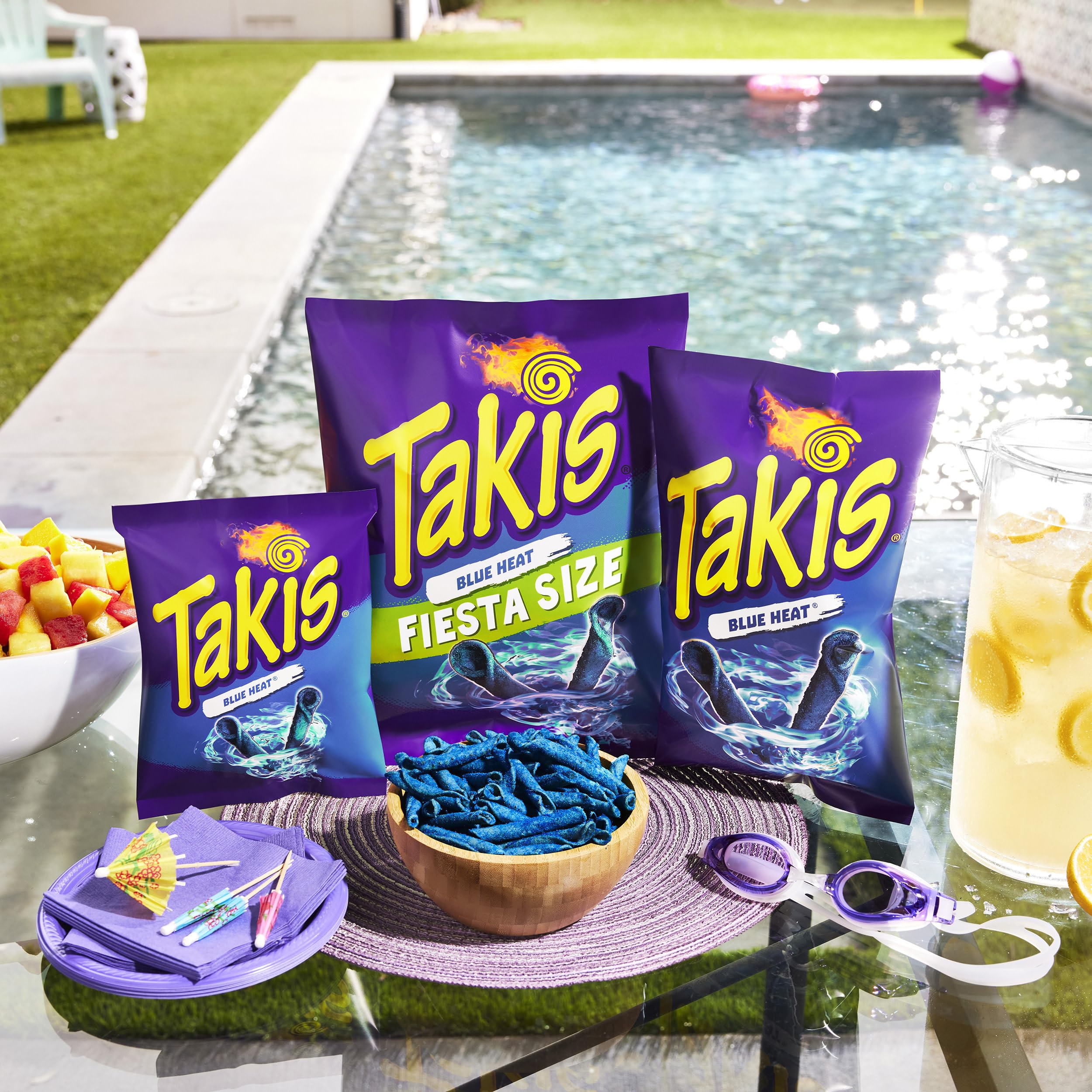 Takis Blue Heat bag pouring chips for a quick office break.