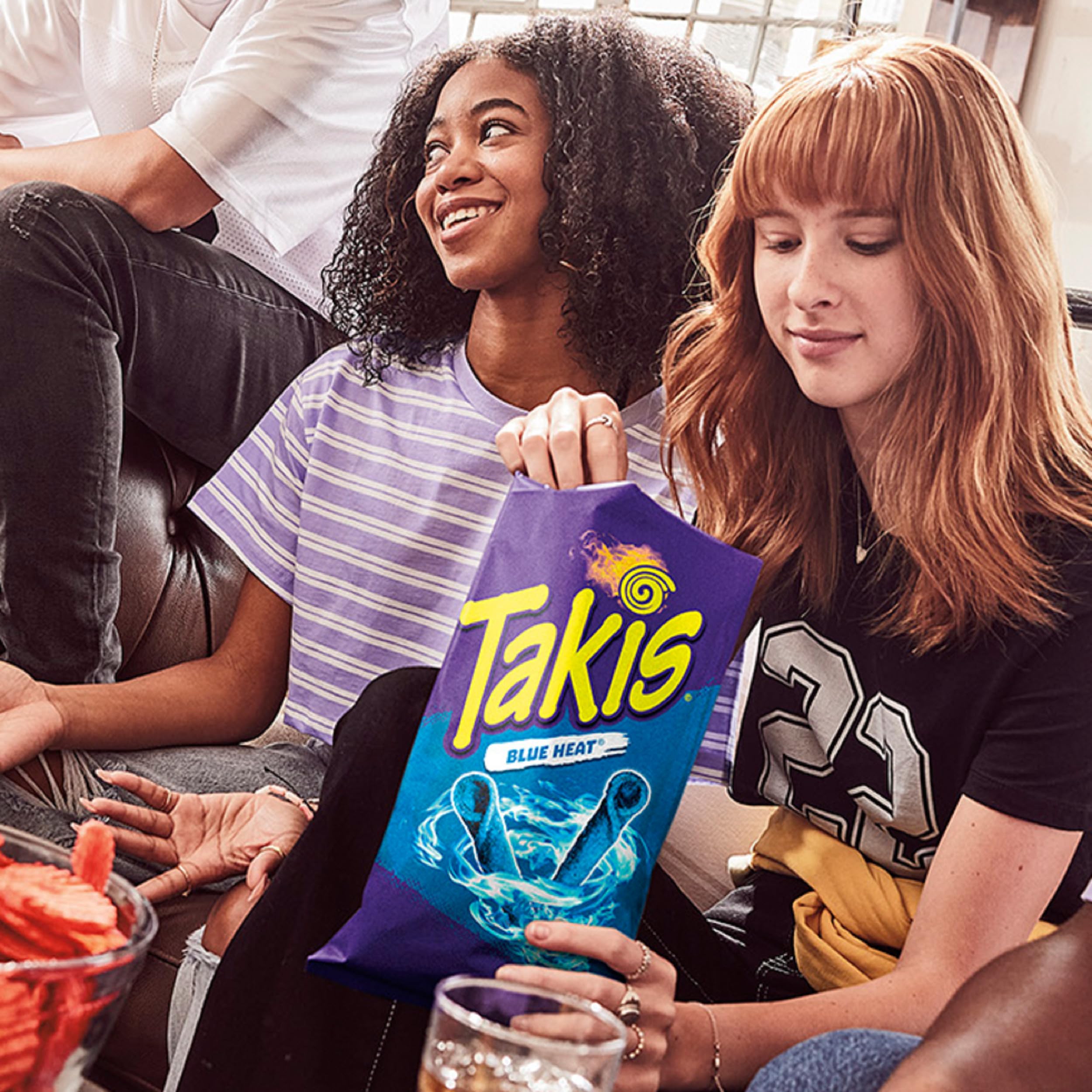 Takis Blue Heat rolled chips closeup highlighting extreme heat appeal.