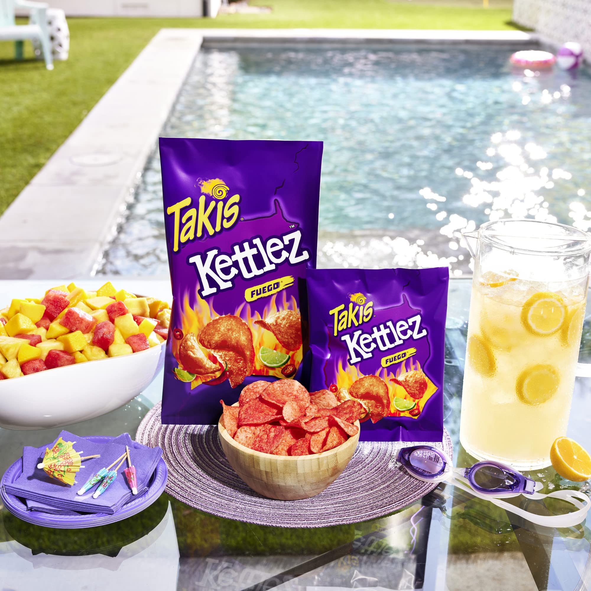 Takis Fuego bag held in hand showing 8 oz sharing size convenience