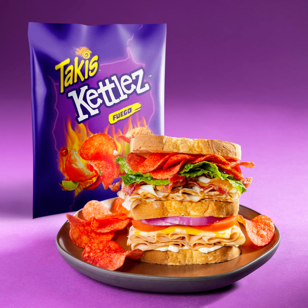 Takis Fuego Kettlez bag beside a phone showing compact snack-size portability