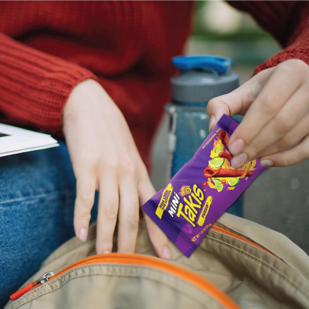 Takis Fuego party snacks on a table for tailgates and celebrations.