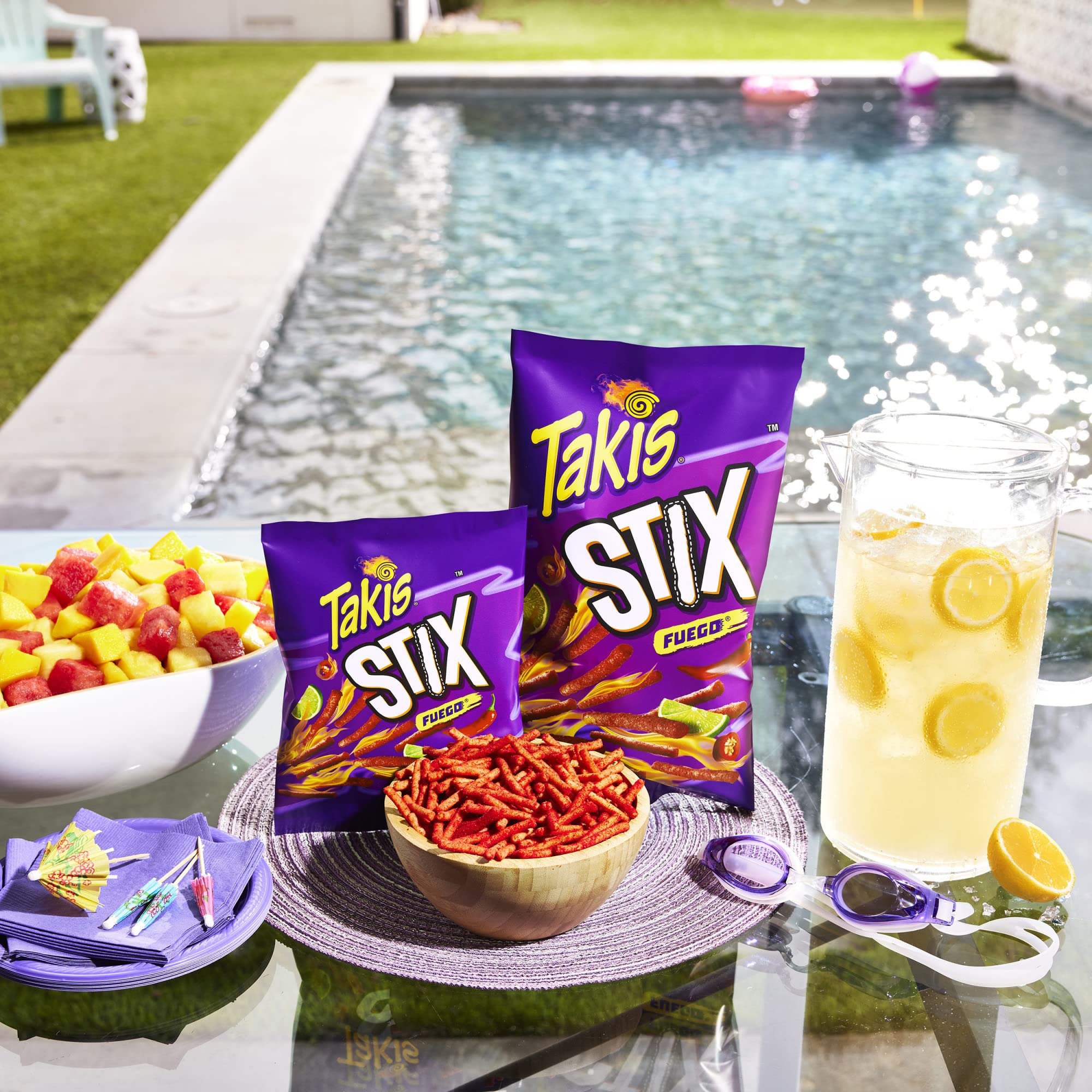 Hand holding Takis Stix, brand visible and easy portion for snacking