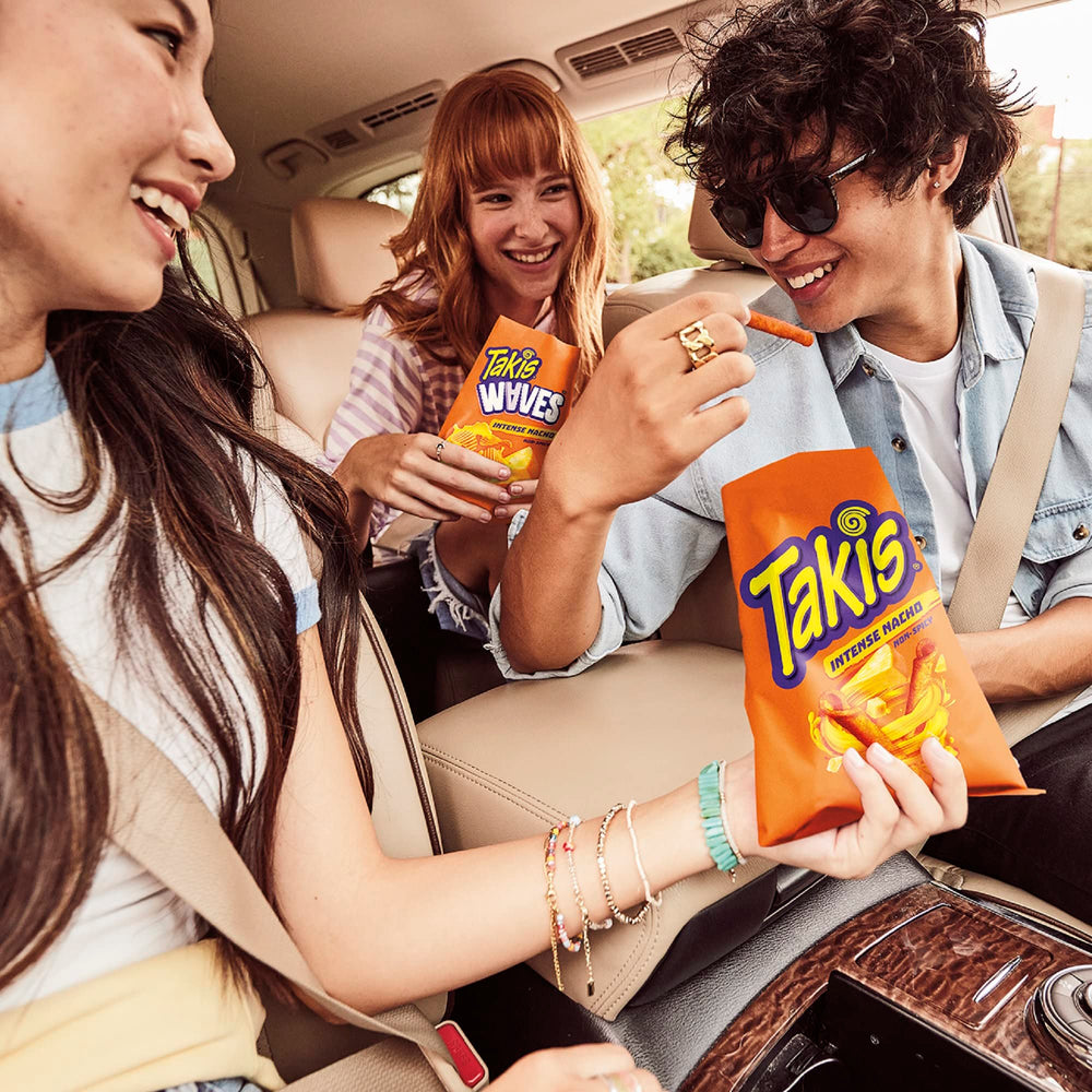 Takis Intense Nacho at a party table with bold crunch.