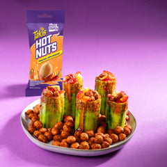 Takis snack-size bag next to smartphone illustrating compact 3.2 oz portability