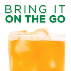 Pouring Tang into a water bottle to create a refreshing drink.