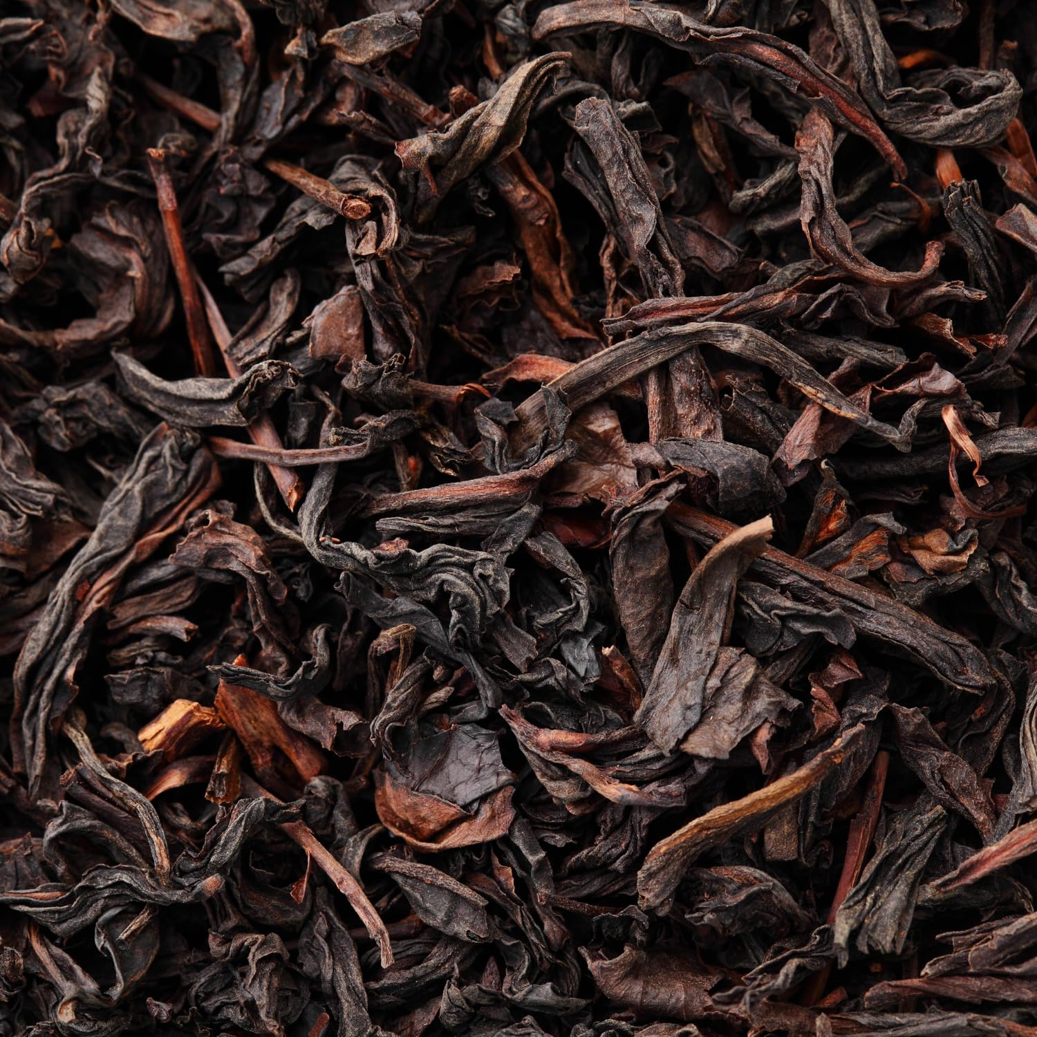Tapal Danedar steeping tea in a cup with steam.