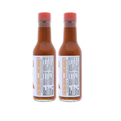 Tapatio Hot Sauce Original bottle pour provides a spicy kick to eggs and tacos.